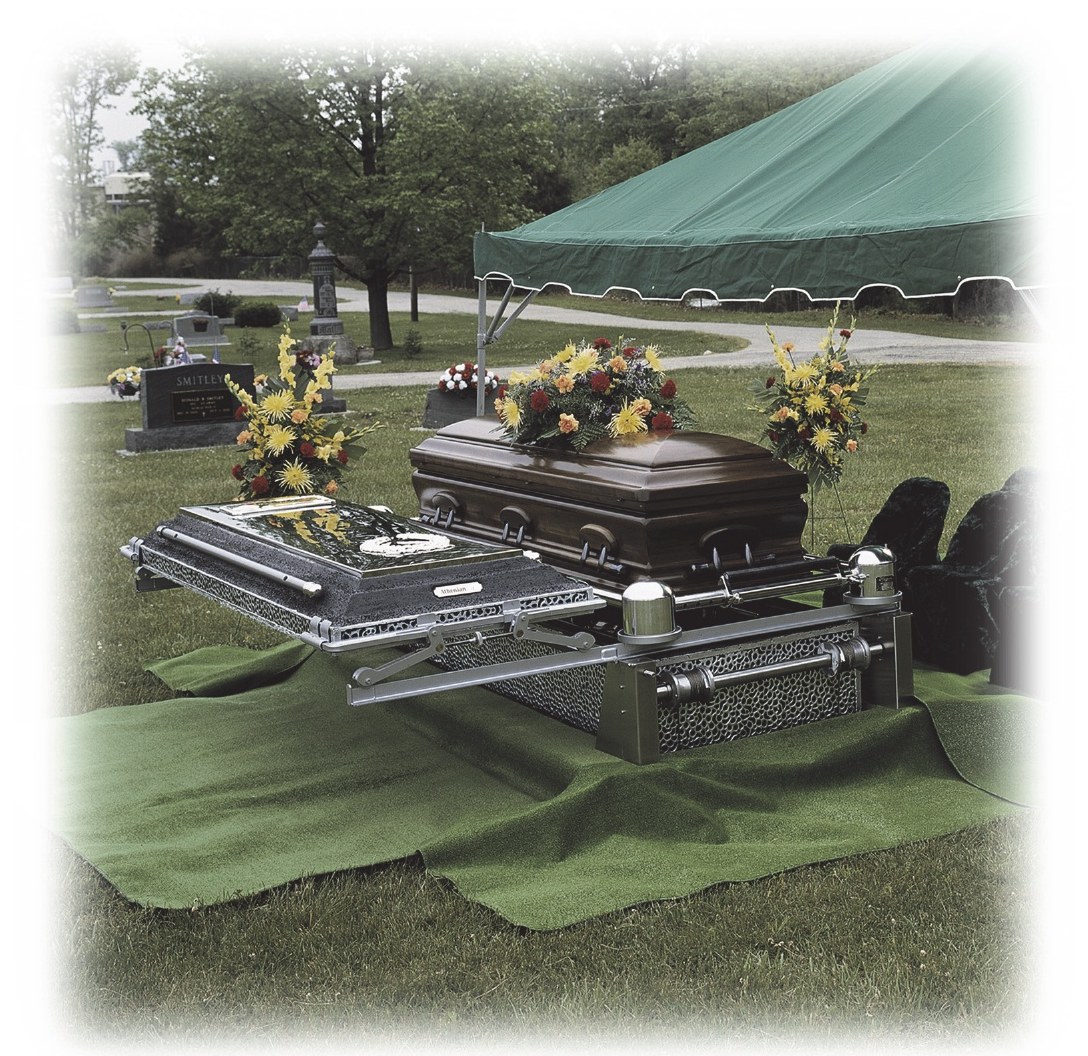 Graveside service with a burial vault lowering device and funeral tent