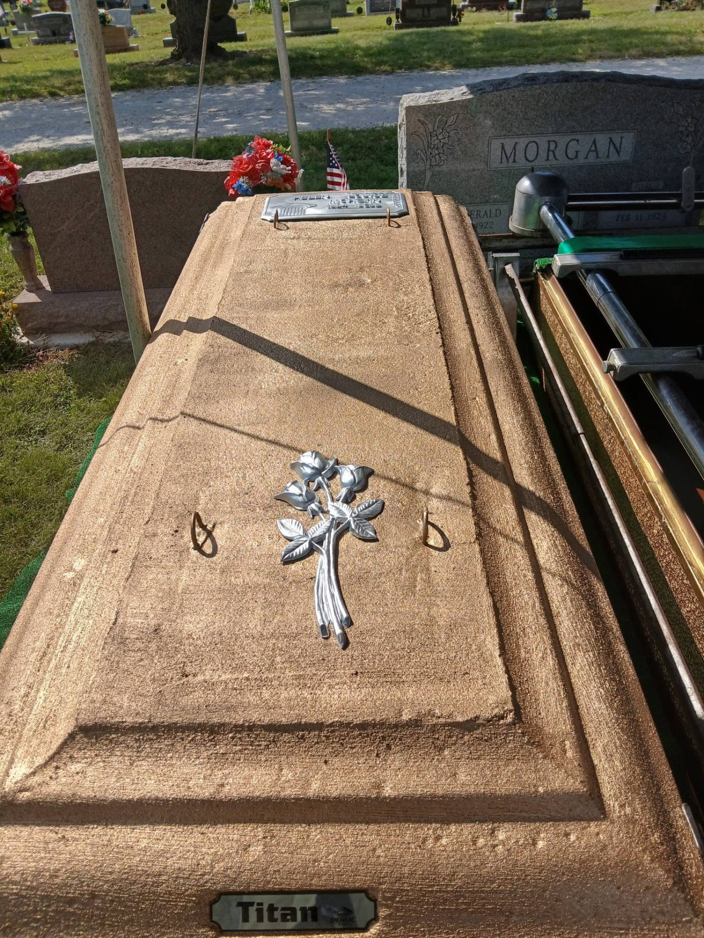 Doric Titan burial vault with silver rose emblem and personalized nameplate