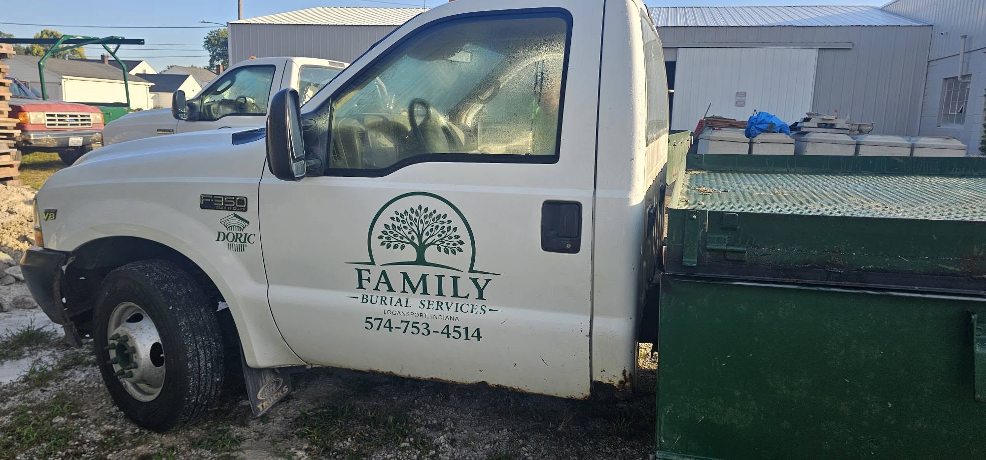 Family Burial Services flatbed truck loaded with burial vault lids