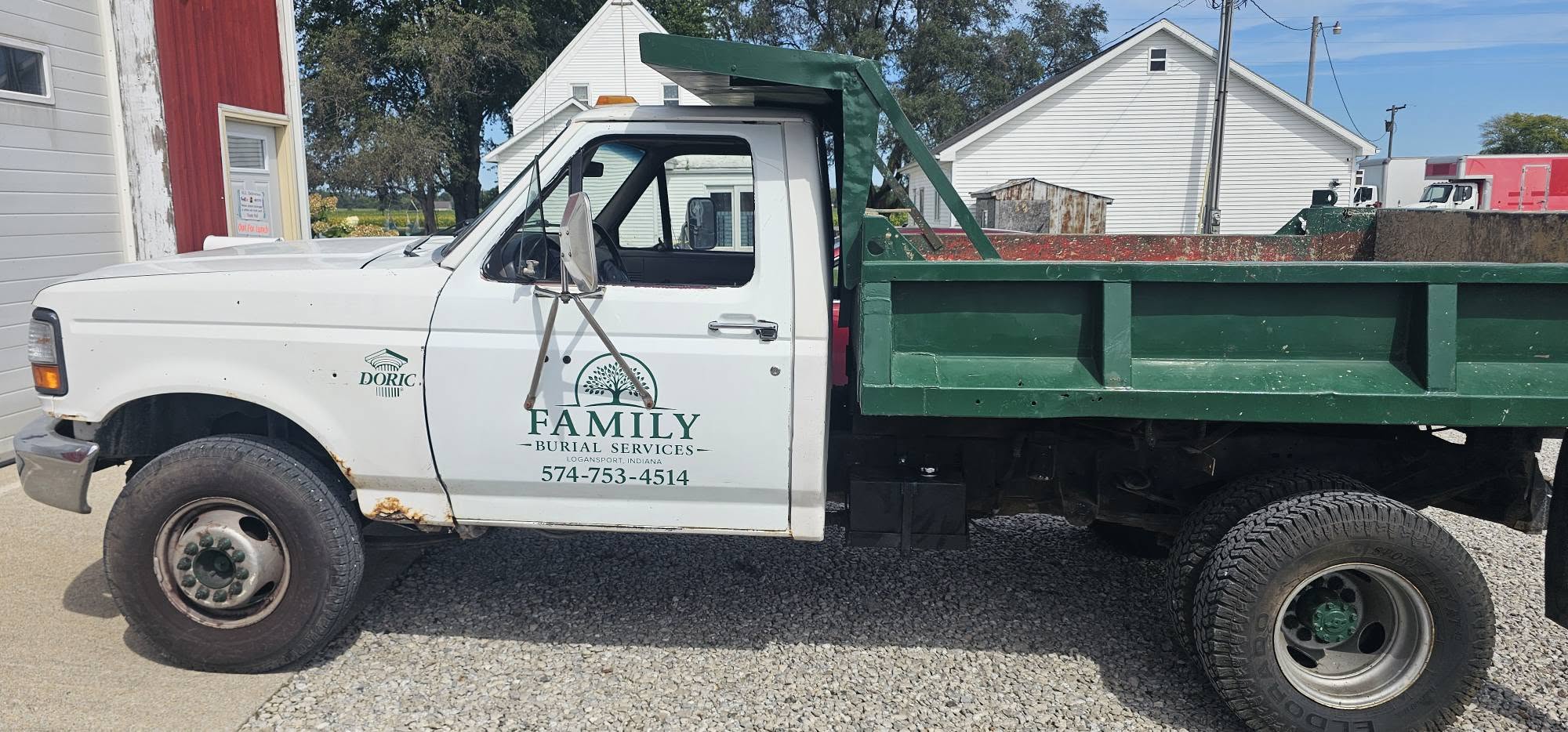 Family Burial Services dump-bed truck used for cemetery excavation work