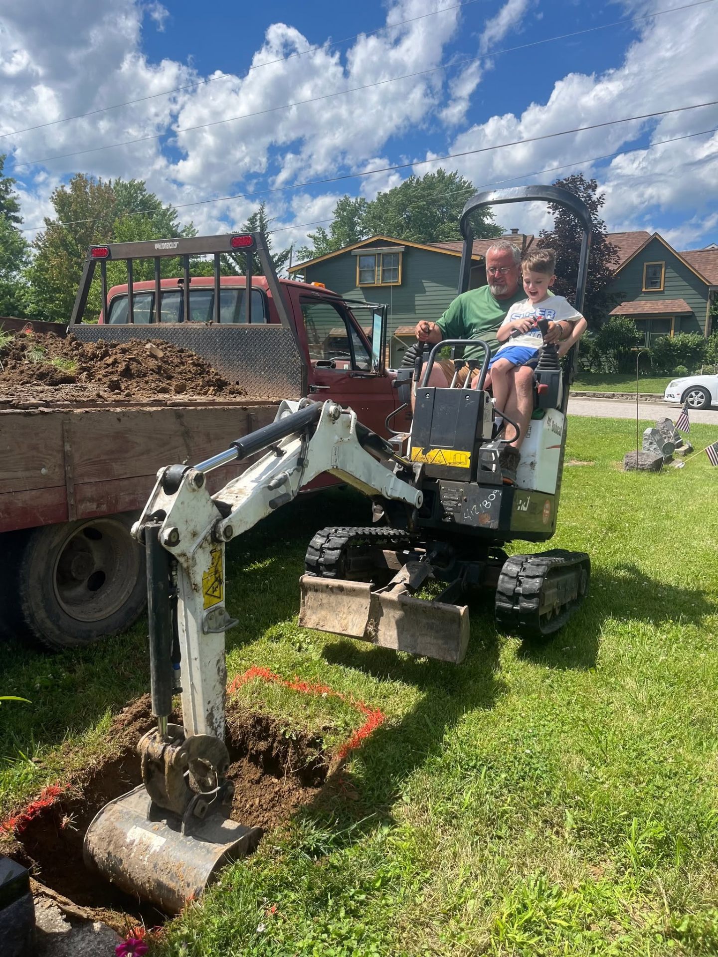 Family Burial Services performing cemetery work with a mini excavator in Logansport, IN